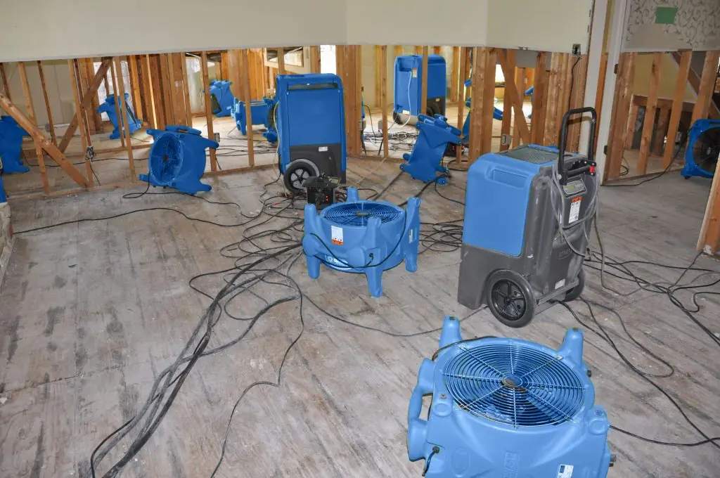 Air movers drying a gutted Boise room after major water damage